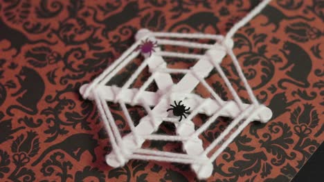 halloween ornament. spiderweb made of stamen thread. steadycam