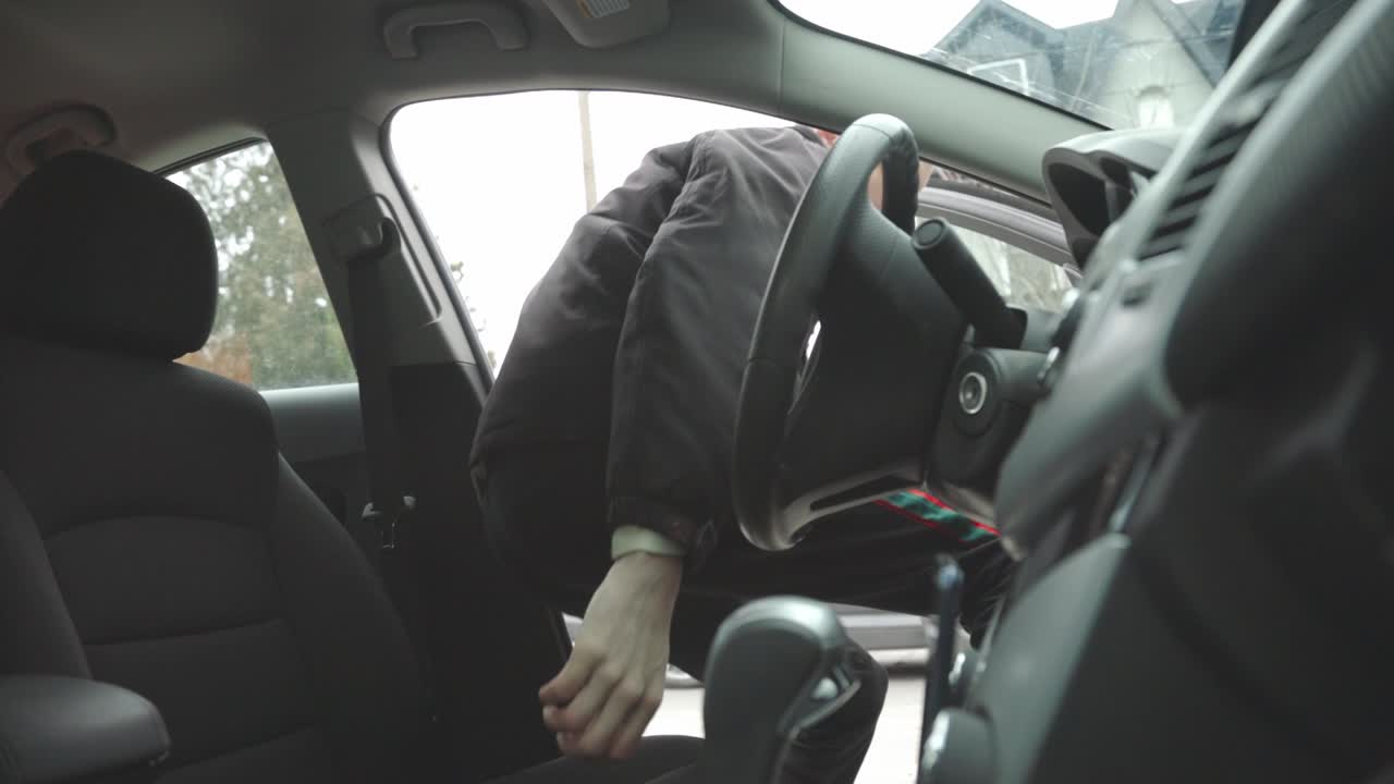 An American Guy Getting Inside of his Car after Leaving his House. - Wide Shot