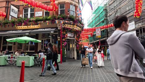 people walking in vibrant chinatown, london