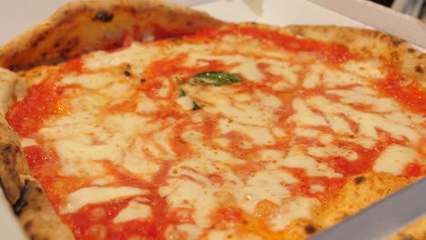 a mouthwatering pizza from l'antica pizzeria da michele in naples, italy - close up