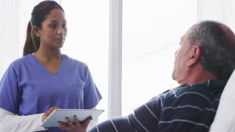 doctor talking to patient in hospital