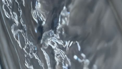 abstract flow of silver-toned liquid
