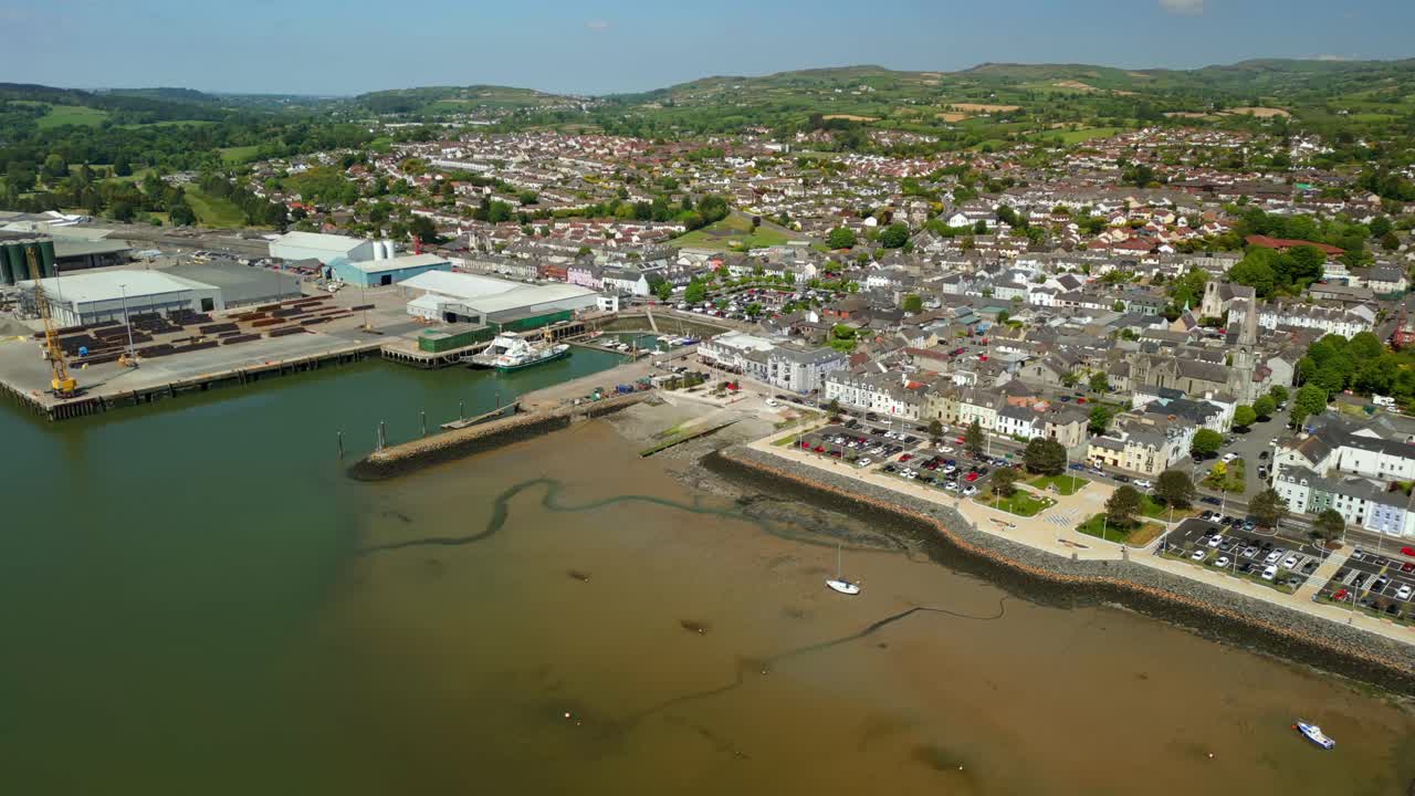 Overhead rising aerial video of Warrenpoint, County Down, Northern Ireland, UK on a bright and sunny day. Filmed in 4K, 60FPS and with Rec709 color.