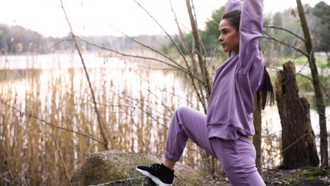 Woman-stretching-in-the-forest