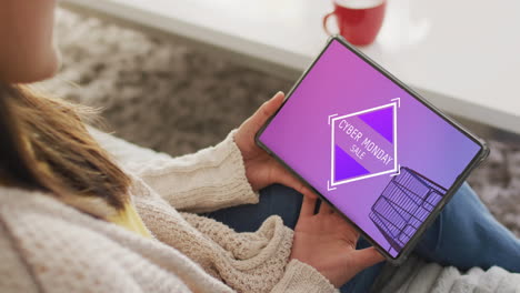 caucasian woman using tablet at home for online shopping, slow motion