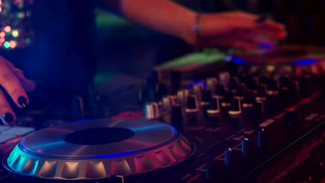 girl dj playing at a nightclub