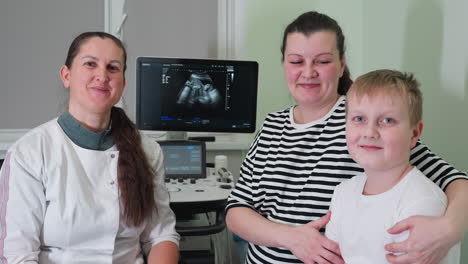 excitement fills the clinical room as a clinical doctor smiles proudly while a satisfied female client and her teenage son smile excitedly after completing their consultation session