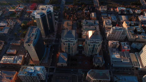 downtown oakland skyscrapers during golden hour, aerial cinematic view