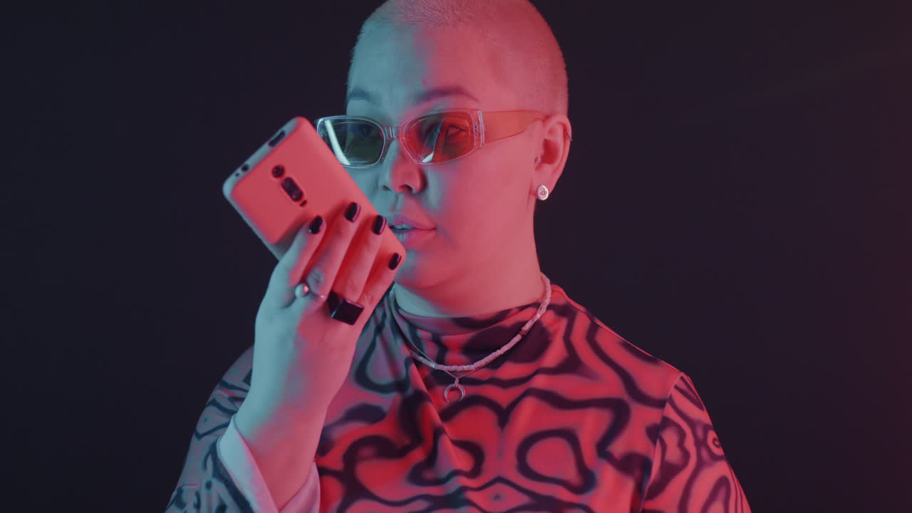 Stylish Plus-Size Woman with Phone in Neon Light