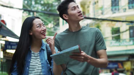 Handheld-view-of-tourists-with-paper-map