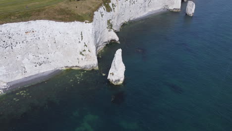 aerial circling sea stack at old harry rocks, jurassic coast, uk