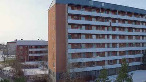 Aerial-view-of-Stockholm-suburb-Husby,-buildings,-drone-in-winter