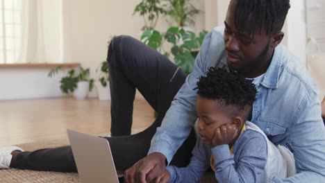 Father-and-son-using-technology-together-at-home