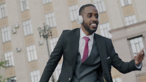 businessman dancing in the city