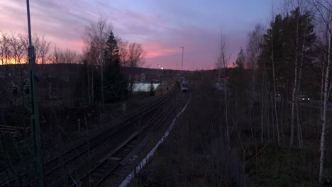train arrives in rural countryside during sunrise
