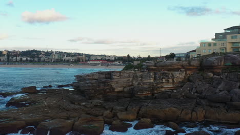 drone shot flying slowly around north bondi, ben buckler in sydney australia