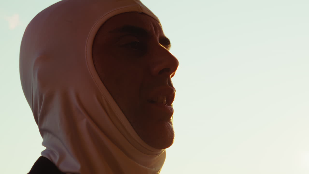 Experienced High-Performance Car Driver Removes His Protective Helmet After Race