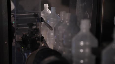 empty plastic bottles being loaded onto conveyor belt vinegar factory