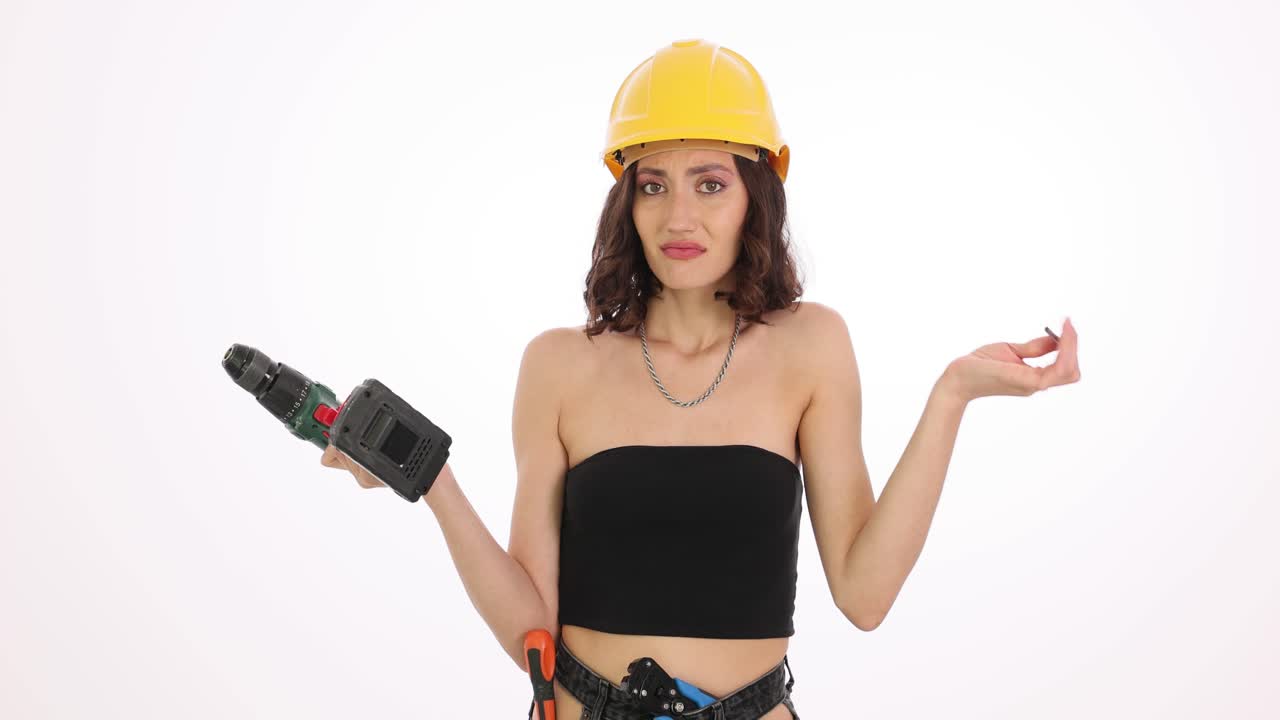 Woman in Hard Hat with Drill and Tools