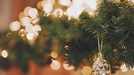 hand woman decorating on christmas tree with christmas glow lights.