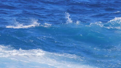 rough ocean waves breaking on the shoreline of an island in the caribbean