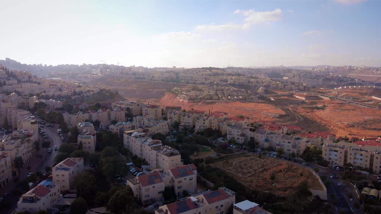 Aerial View of a Residential Neighborhood with Buildings and Undeveloped Land