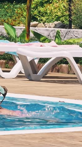 happy children near swimming pool