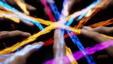 a dynamic interaction of colorful lights and hands, capturing the essence of collaboration and unity in a mesmerizing visual display of connectivity
