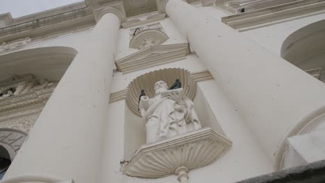 Slow-motion-forward-motion-footage-of-a-saint-sculpture-outside-of-a-church-in-Antigua,-Guatemala