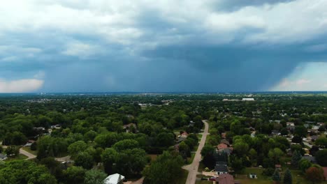 aerial moving toward the downpour of rainfall over appleton, wisconsin