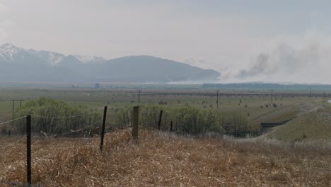 Natural-Disaster-from-Climate-Change,-Smoke-Over-Mount-Cook-National-Park-with-Dry-Grass