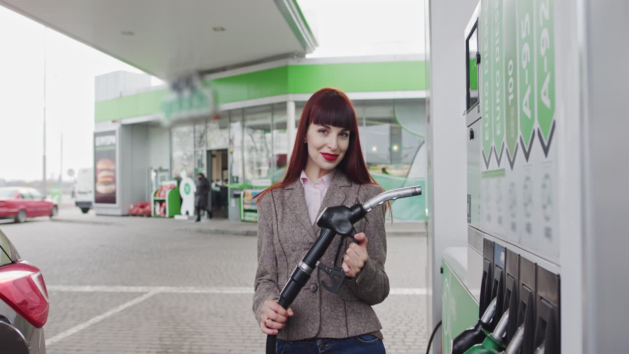 Woman Filling Up Gas at a Station