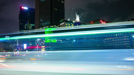 night illuminated jakarta city center famous traffic street circle fountain timelapse panorama 4k indonesia