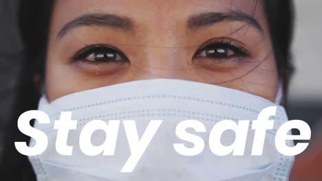 asian woman wearing a coronavirus covid19 mask  with words stay safe