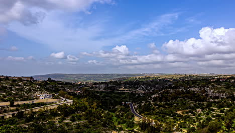 time-lapse of the beautiful italian landscape of sicily, italy with view of the historical buildings, passing clouds and nature on a summer day