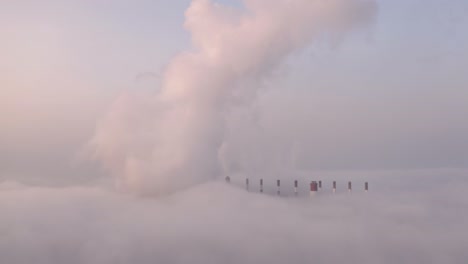 beautiful landscape coal power plant in the morning time with fog.