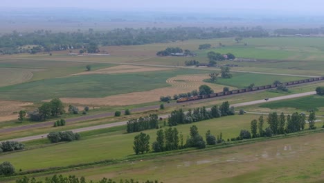 train passes through vast nebraska prairie near chimney rock area