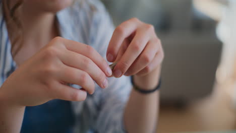 Woman-Holding-Pen-in-Hands-Daydreaming