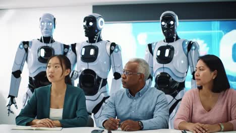 a diverse group engages in a meeting with advanced robotics in the background, highlighting the future of human-robot collaboration and innovation