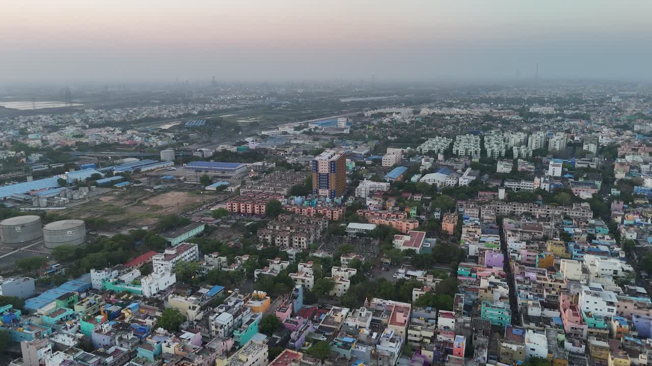 Railway junction slicing through a developing metropolitan backdrop