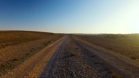 pov drone shot on off-road during sunset