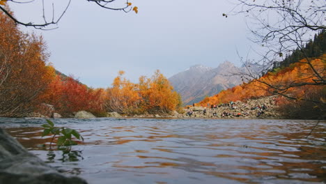 autumn mountain river landscape with people