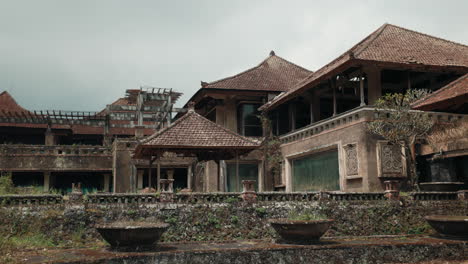 abandoned tropical resort with traditional architecture
