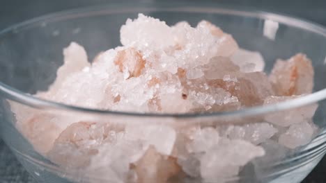 himalayan pink salt crystals in glass bowl