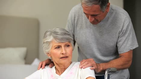 Woman-in-a-wheelchair-speaking-with-her-husband