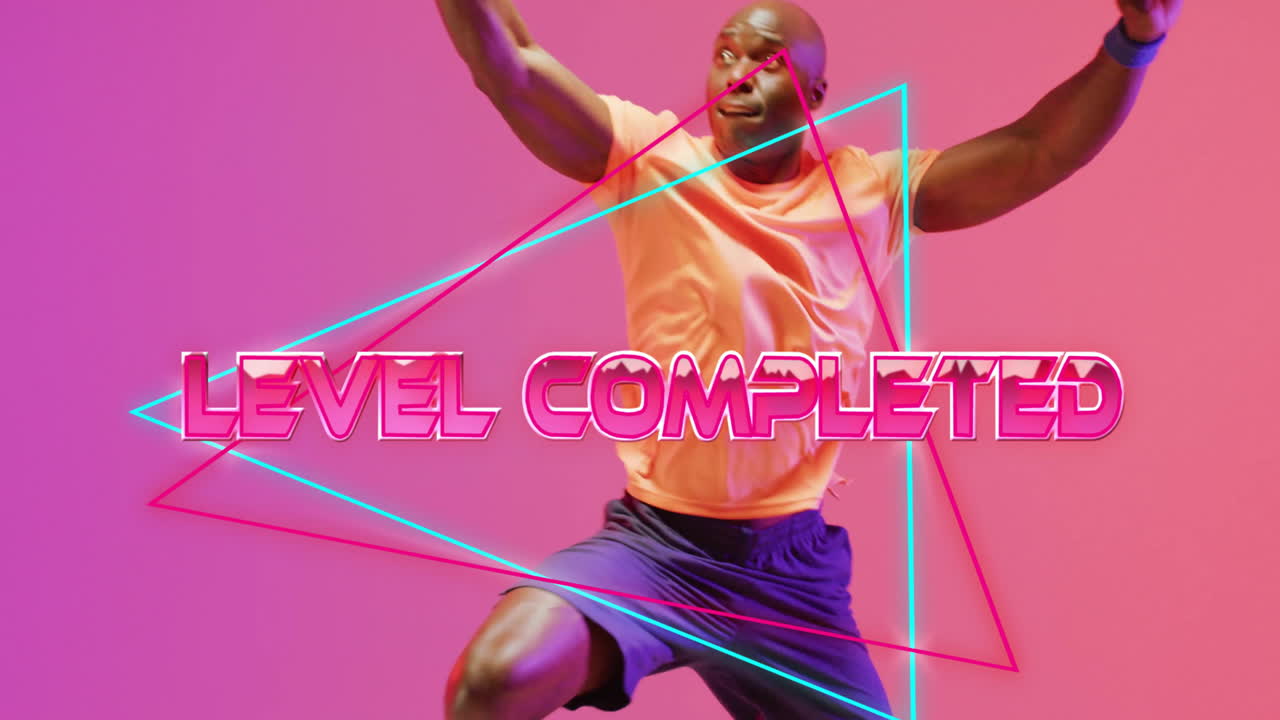 Level completed text animation over person playing basketball on pink background