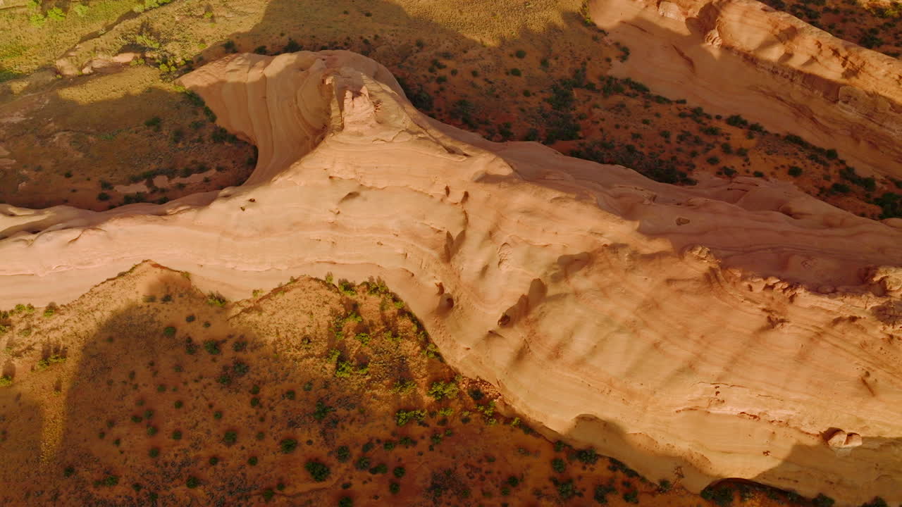 Beautiful rock formations with rounded sides from air erosion. Drone footage over the amazing canyons in Utah, USA.