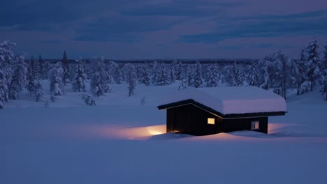 warm light emanates from windows of a cozy wooden cabin nestled in a snow covered landscape, surrounded by snow laden trees under a dusky sky, creating a serene winter scene at twilight