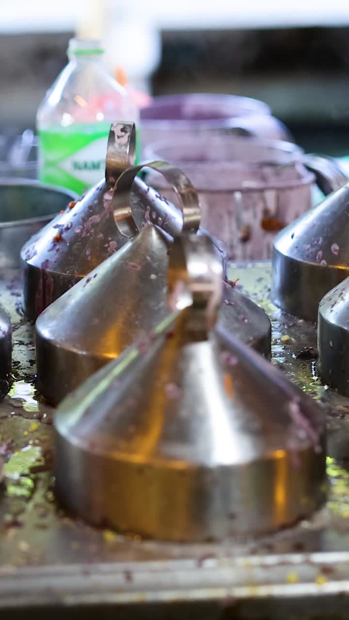 Stainless steel pots displayed at Bangkok floating market