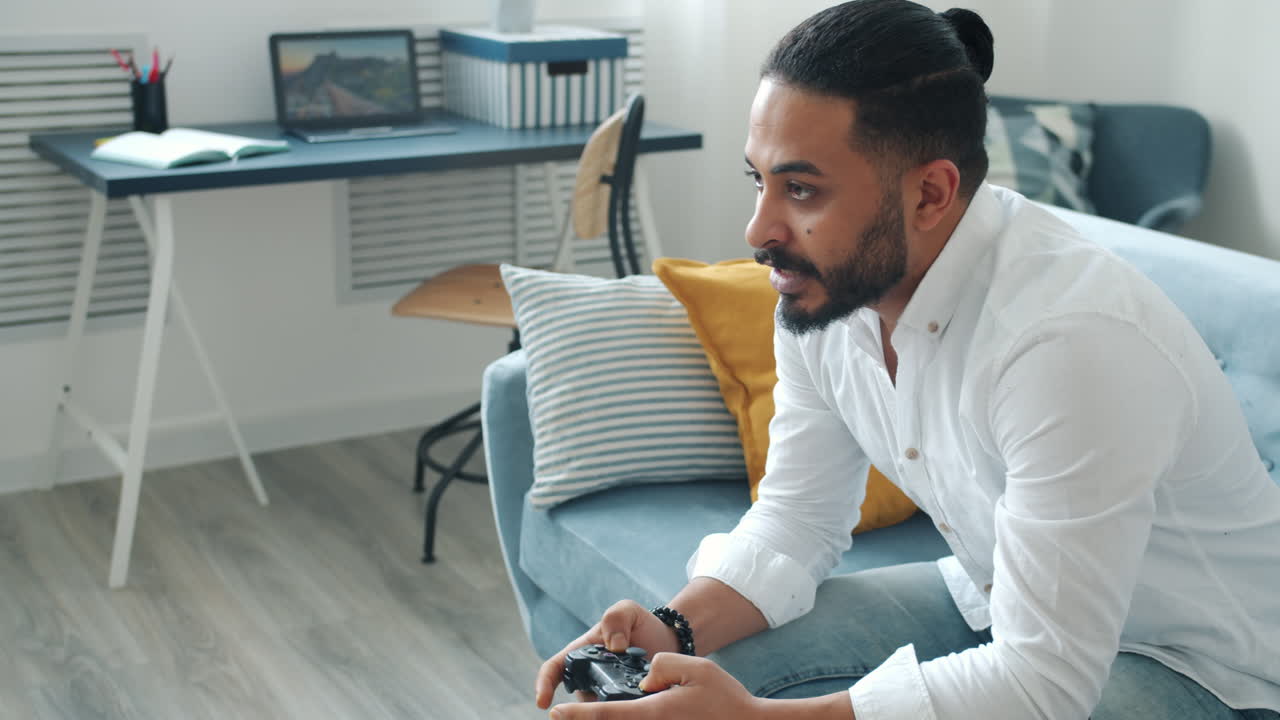 Man Playing Video Games on Couch